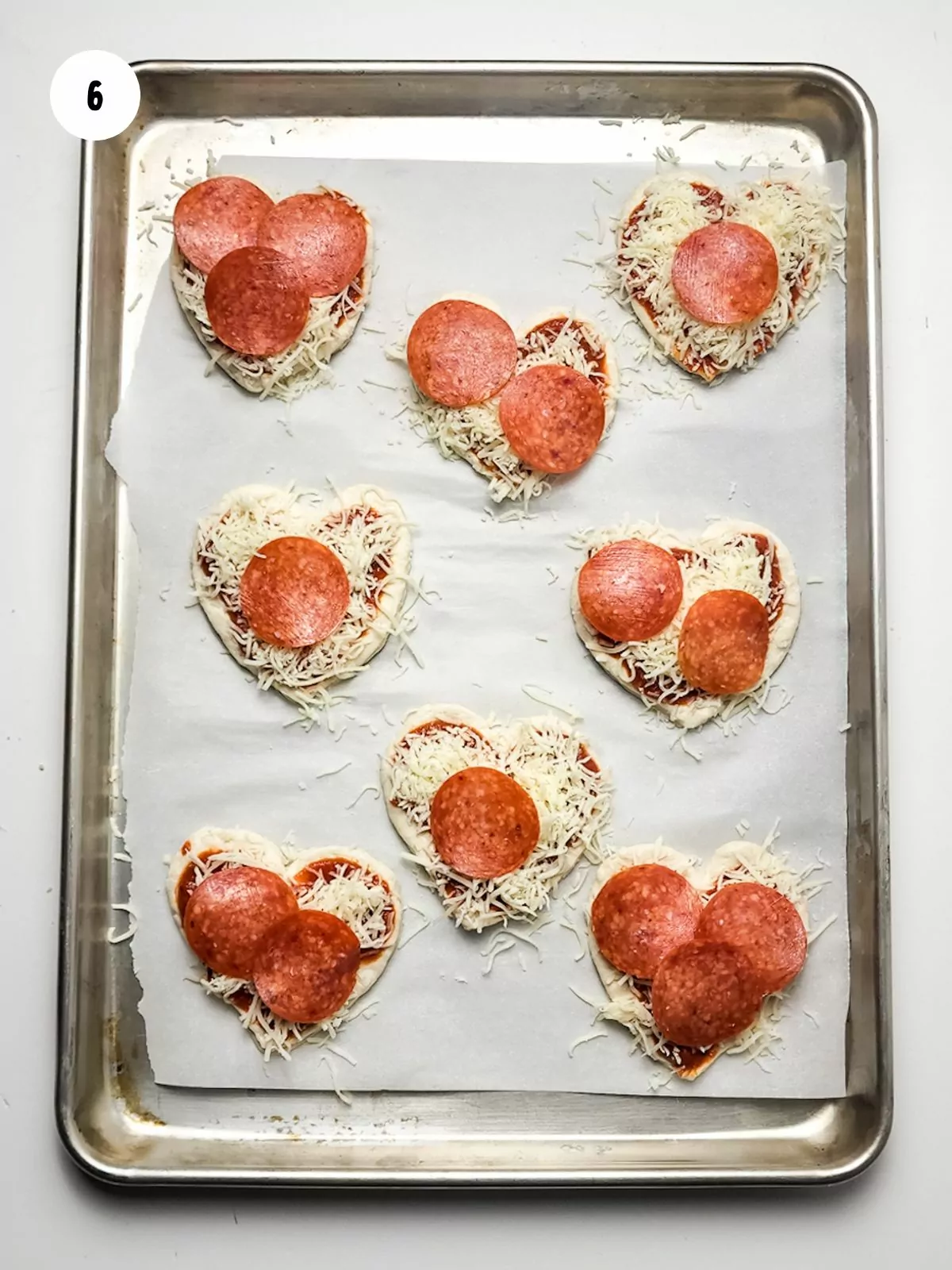 pepperonis added to heart pizzas