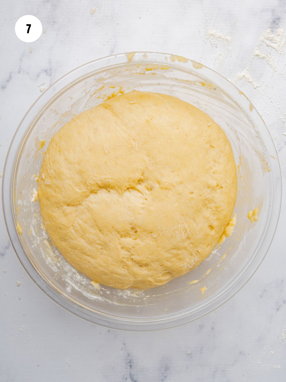 risen dough in the mixing bowl