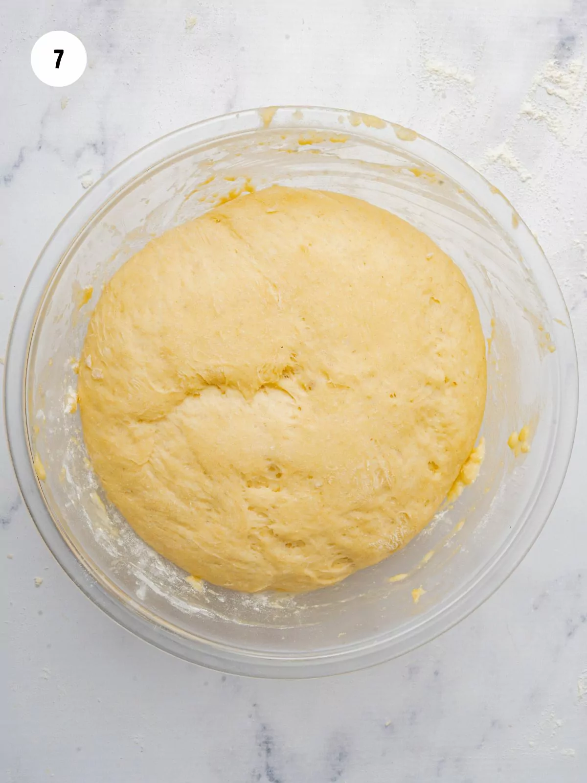 risen dough in the mixing bowl