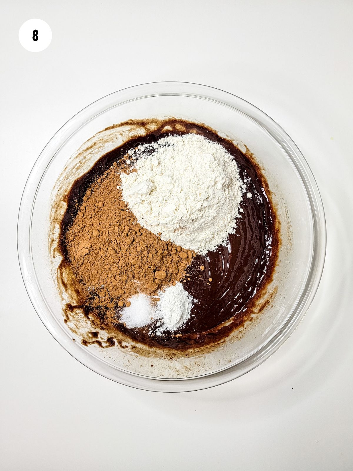 flour, cocoa powder, salt, and baking soda added to bowl