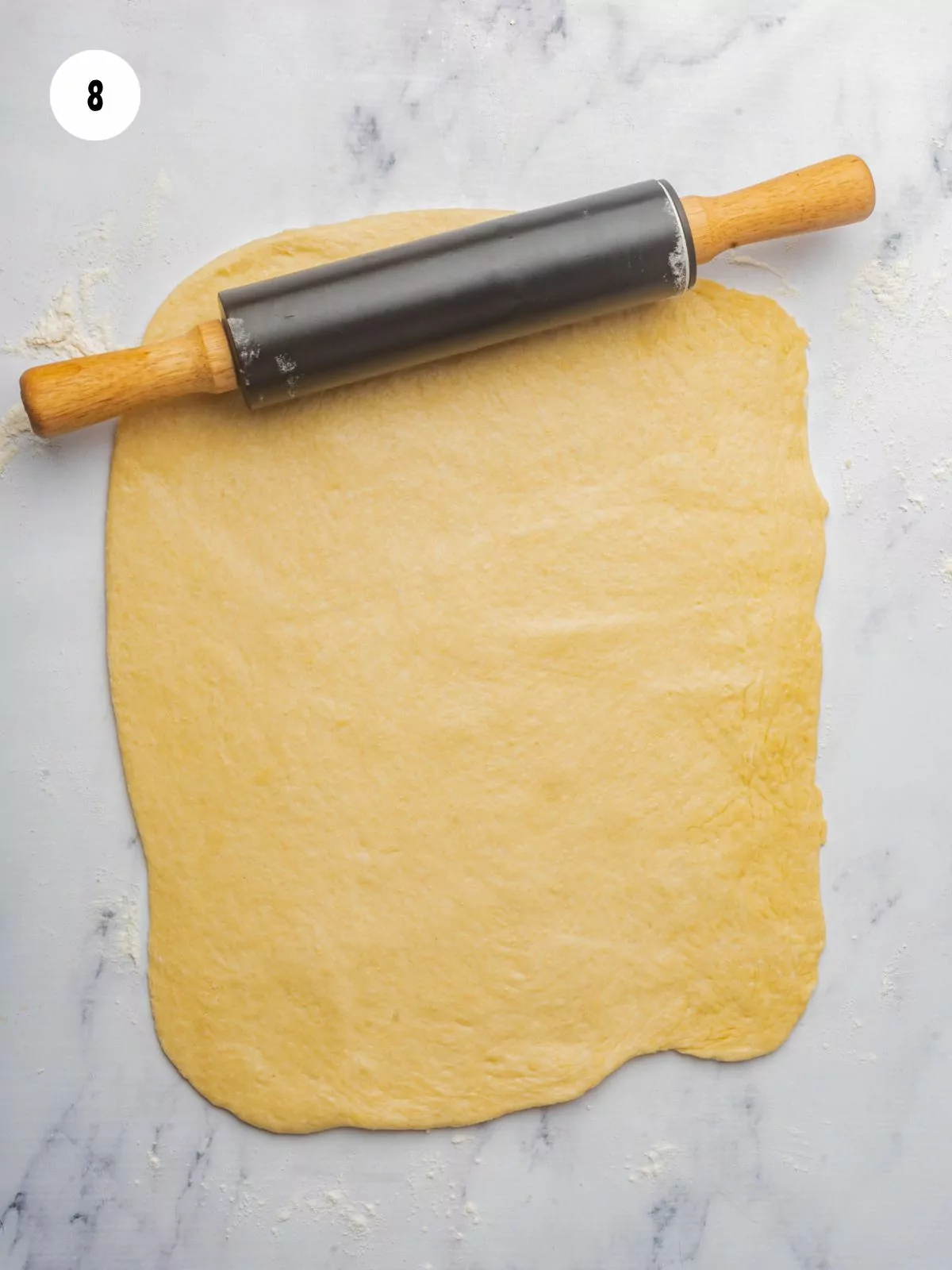 rectangle of rolled out dough and a rolling pin