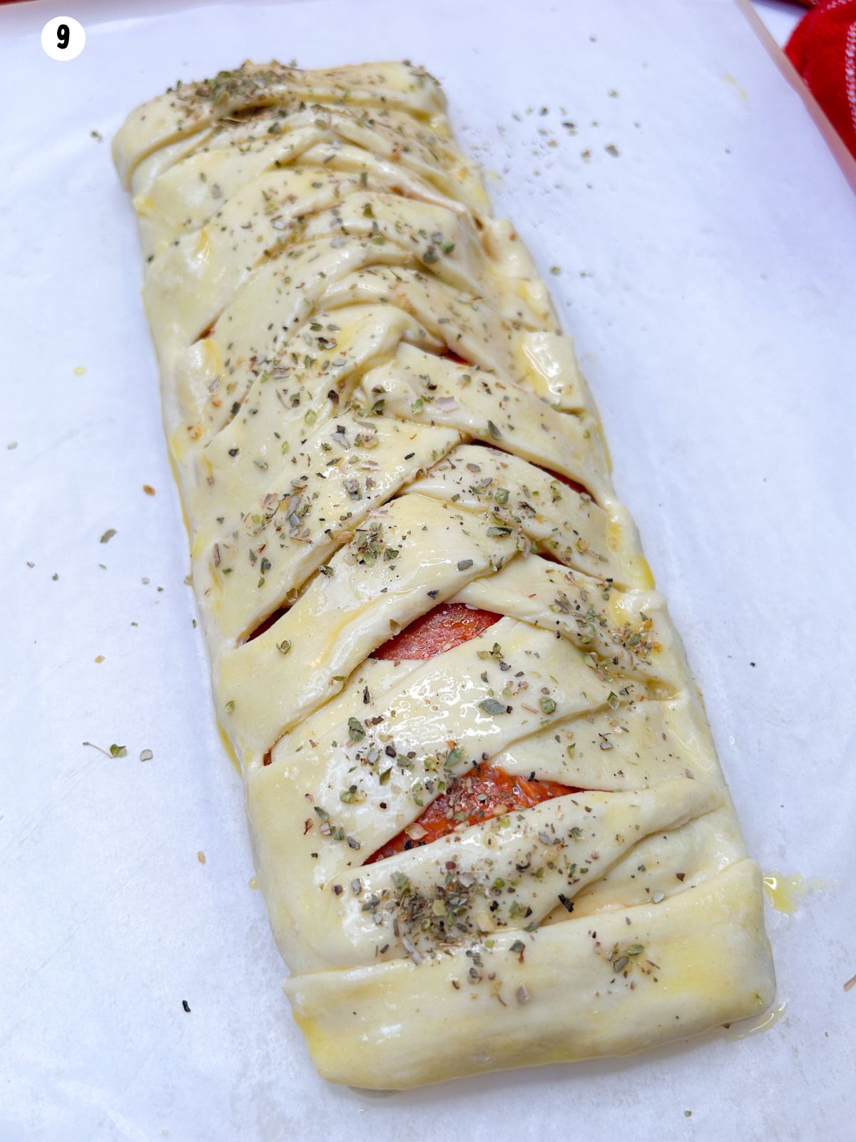 puff pastry braid sprinkled with Italian seasooning