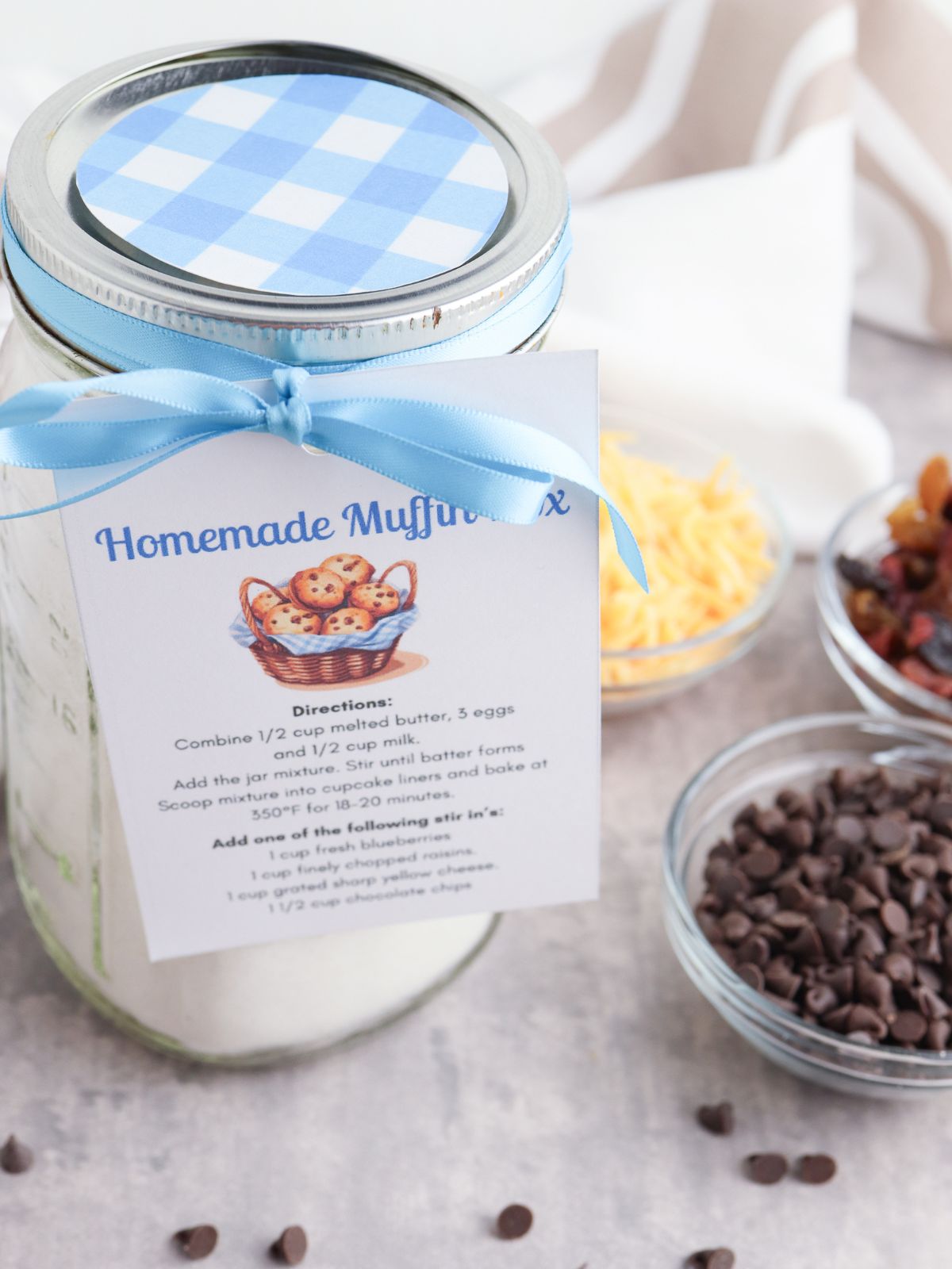 Homemade Muffin Mix in a Jar with light blue ribbon and instruction card attached