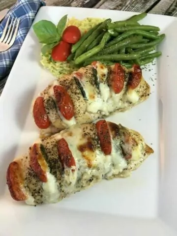 Hasselback Chicken Recipe Stuffed with Mozzarella, Tomato and Basil-Cover image.