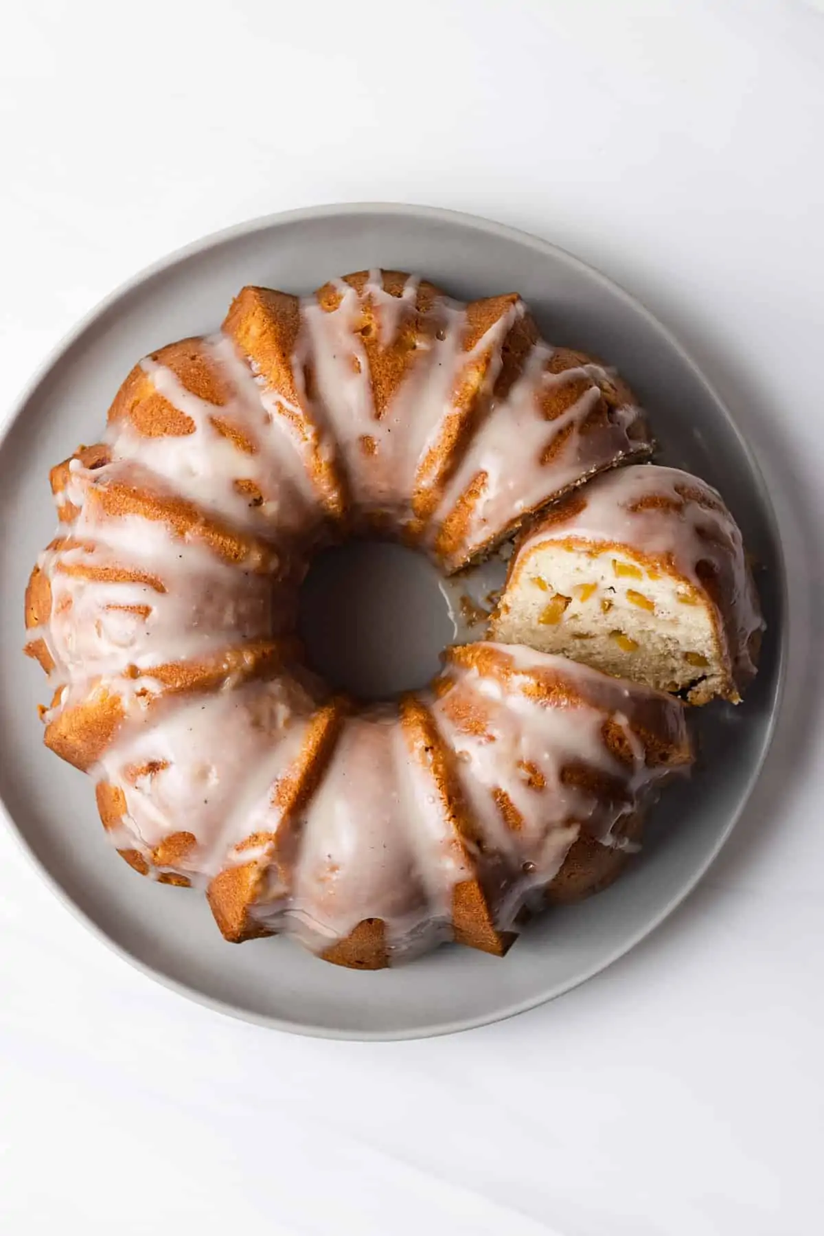 pound cake in a plate topped with glazed