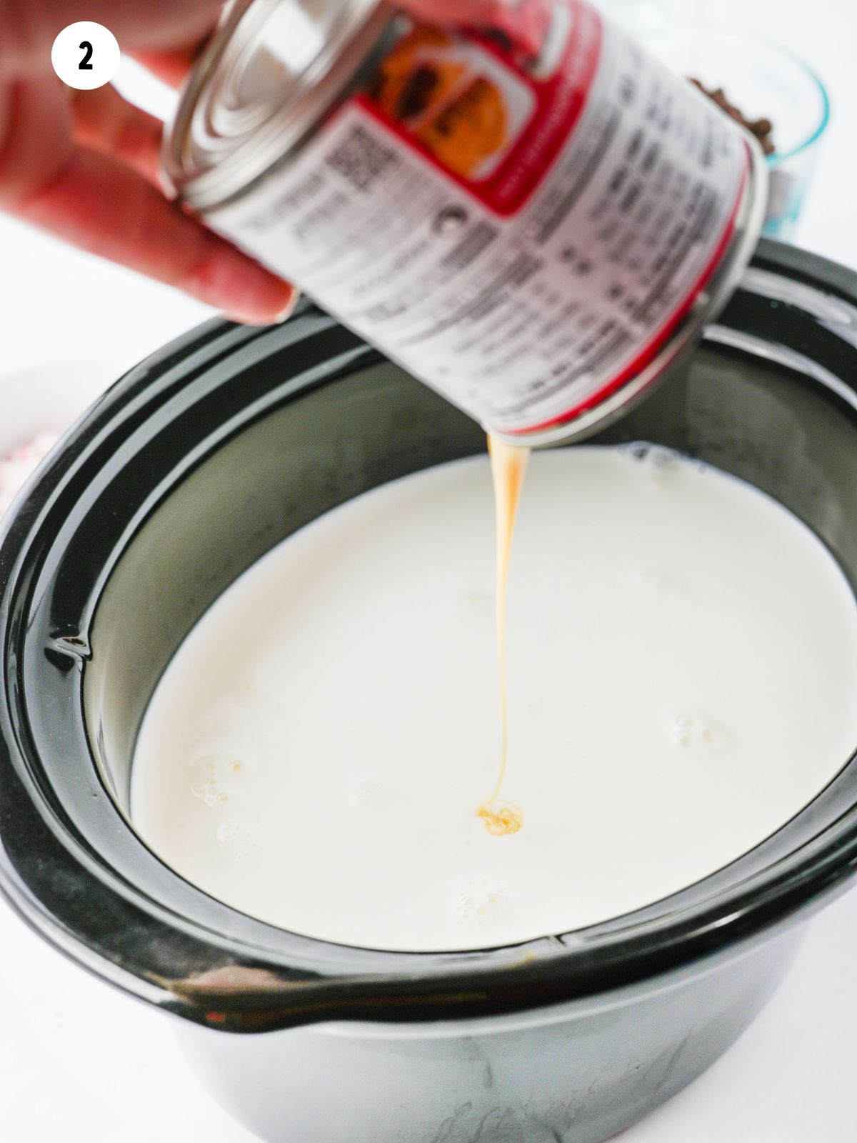 add sweetened condensed milk to crock pot.