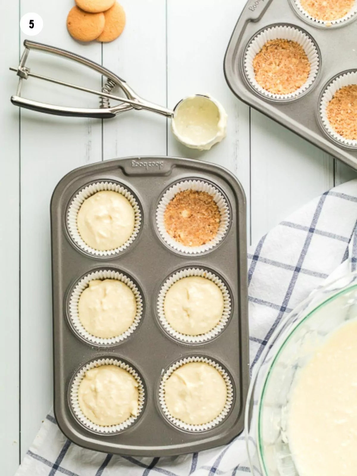 add batter to muffin tin and cookie crumbs.