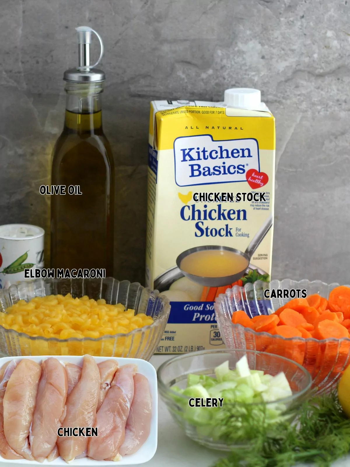 ingredients for soup, chicken, celery, carrots, broth.