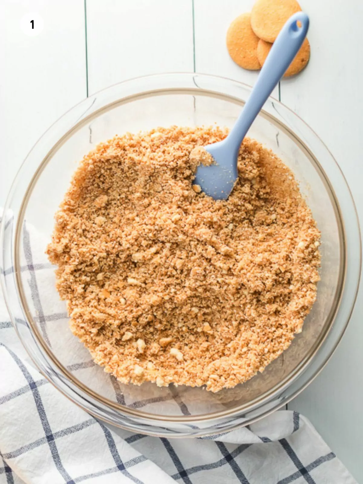 combine cookie crumbs with melted butter in bowl.