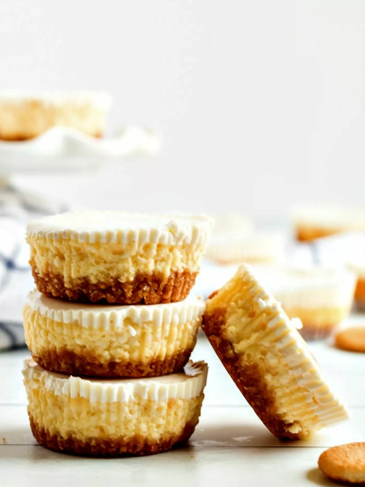 stacked cheesecakes on cutting board.