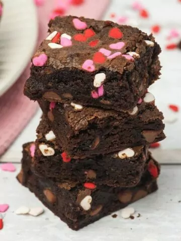 stack of brownies with heart sprinkles.