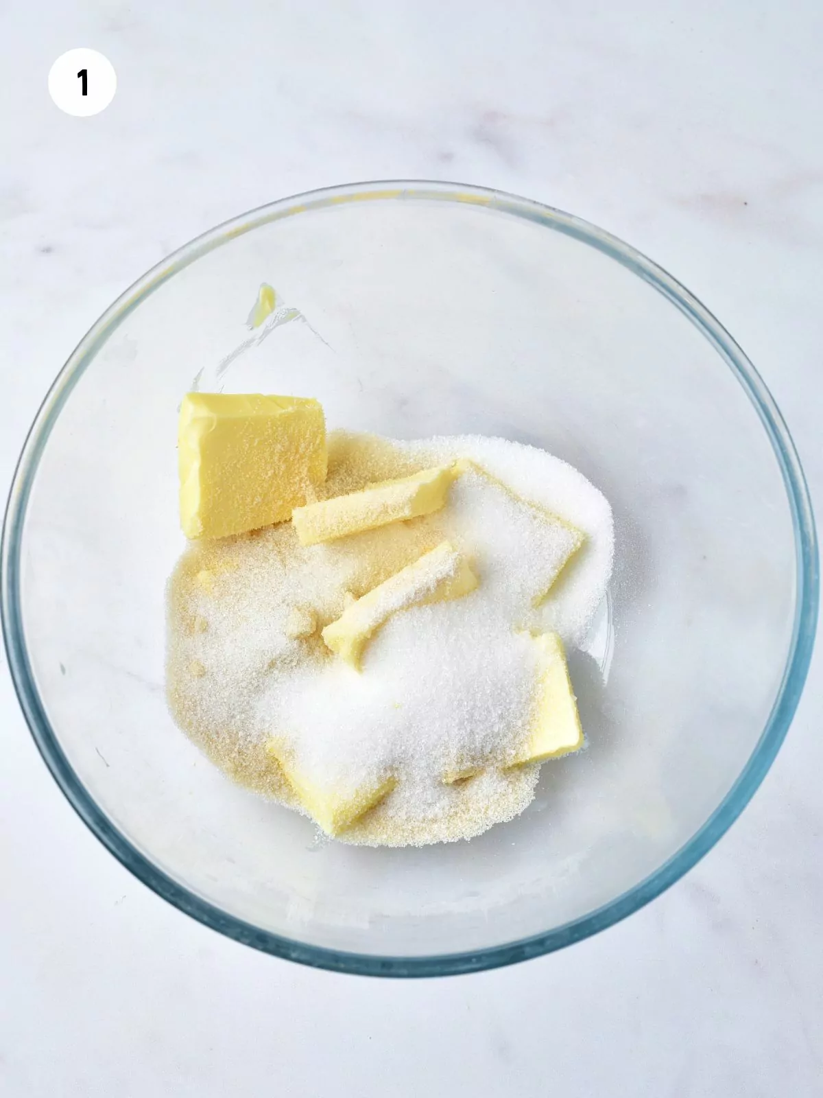 butter and sugar in clear mixing bowl