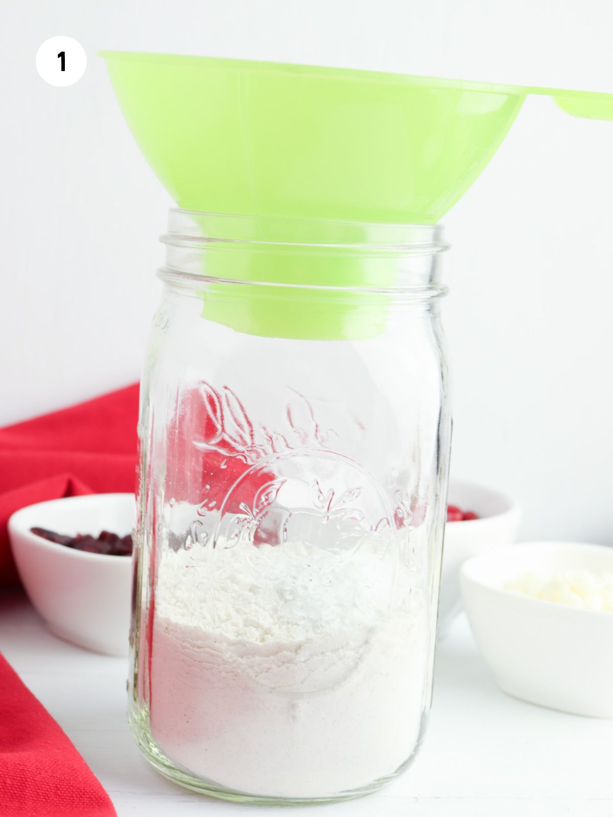 flour added to jar with wide mouth funnel