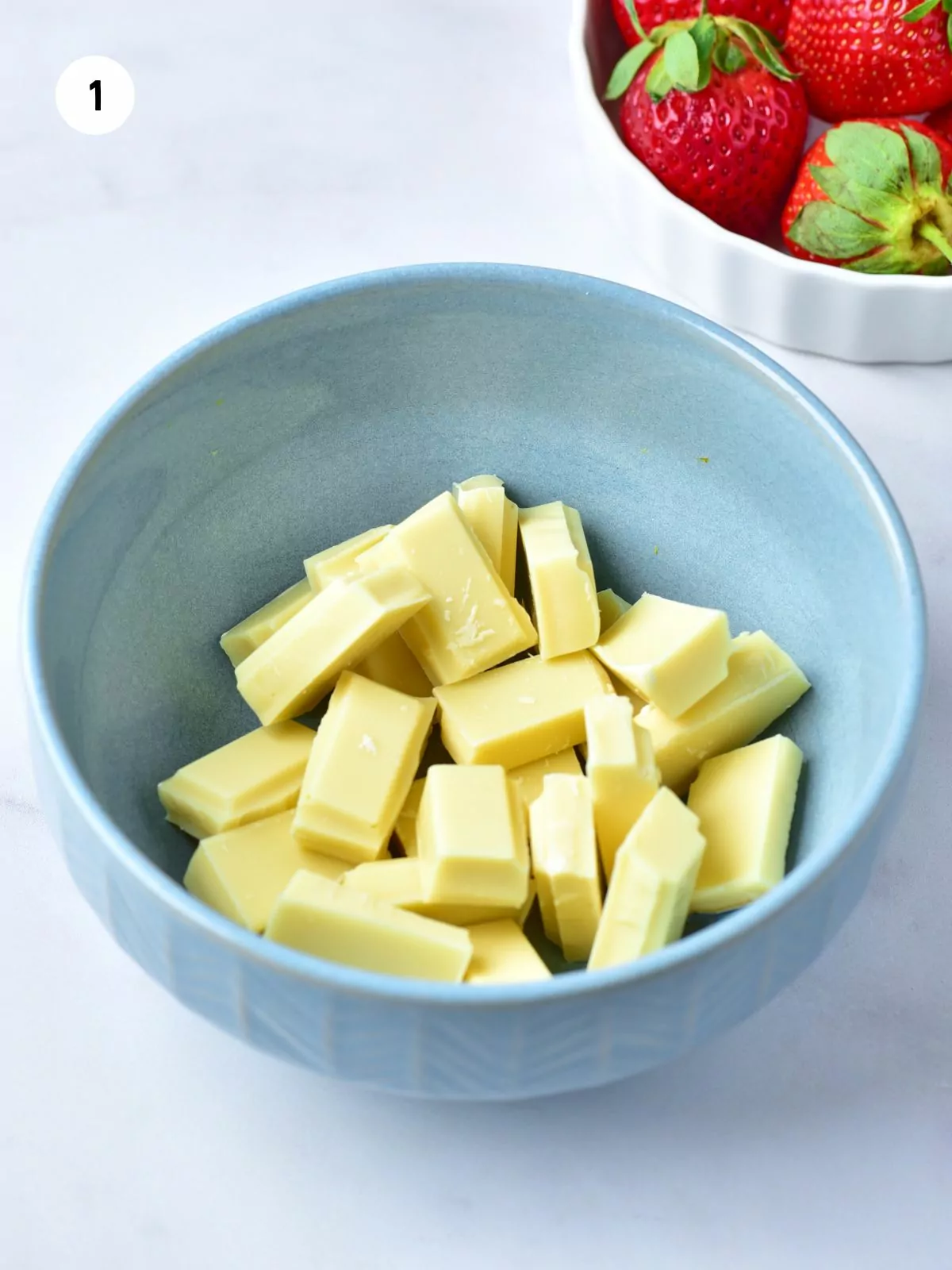 white chocolate chunks in a blue bowl