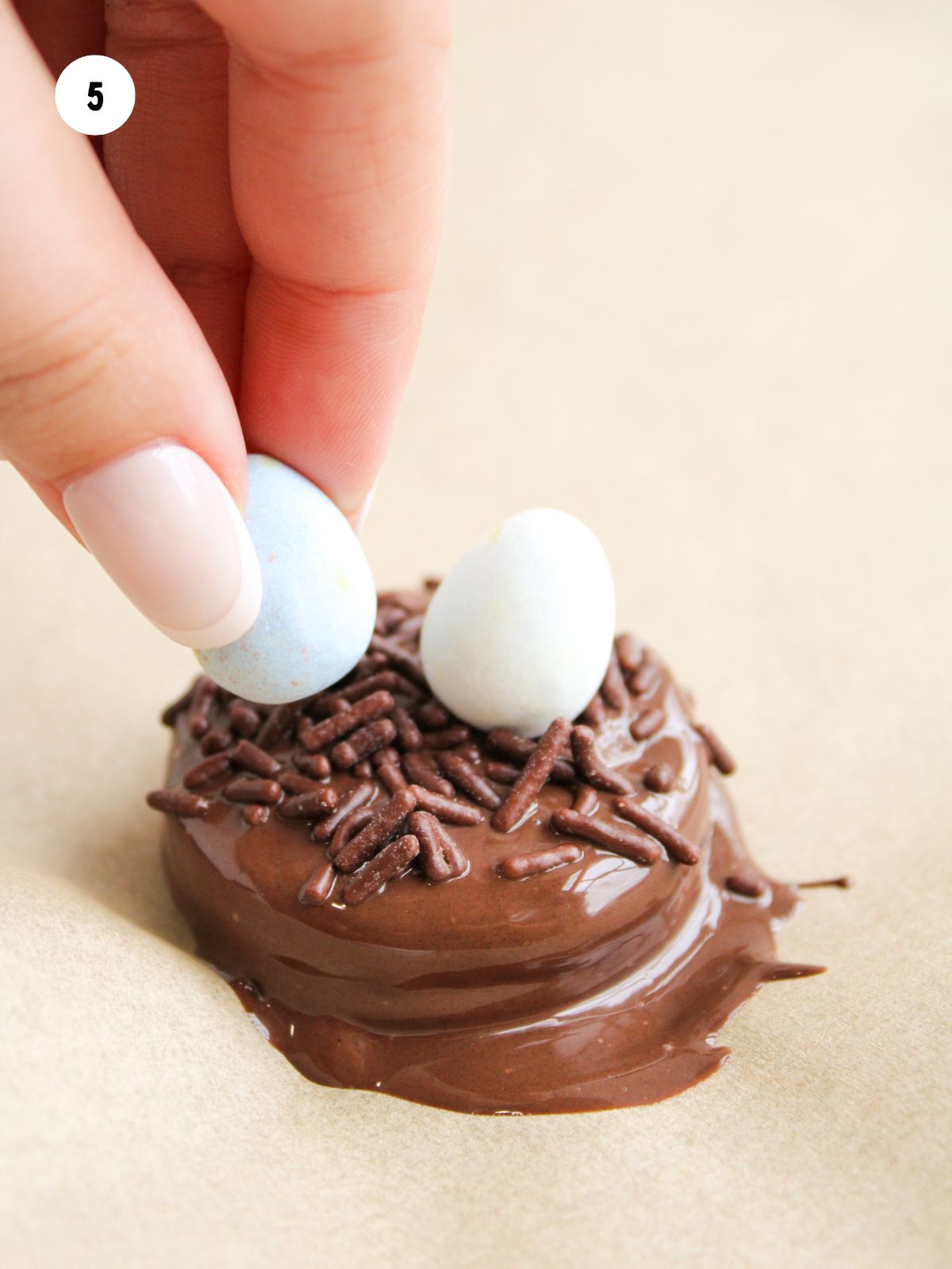 mini eggs added to the sprinkles on the wet chocolate