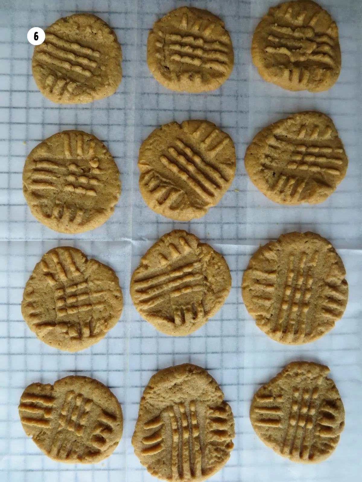 baked gluten free peanut butter cookies on a cooling rack