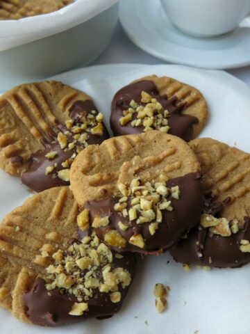 Gluten Free Peanut Butter Cookies dipped in chocolate and chopped peanuts