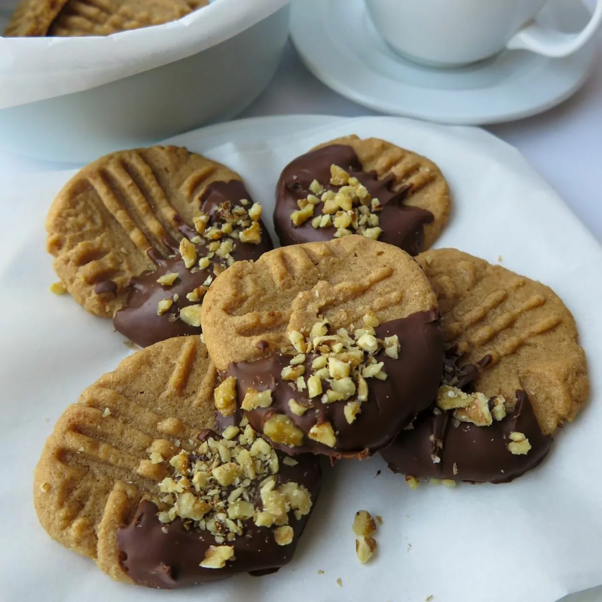 Gluten Free Peanut Butter Cookies dipped in chocolate and chopped peanuts