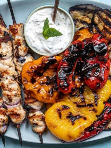 Greek yogurt dip with grilled veggies and chicken. MSN.