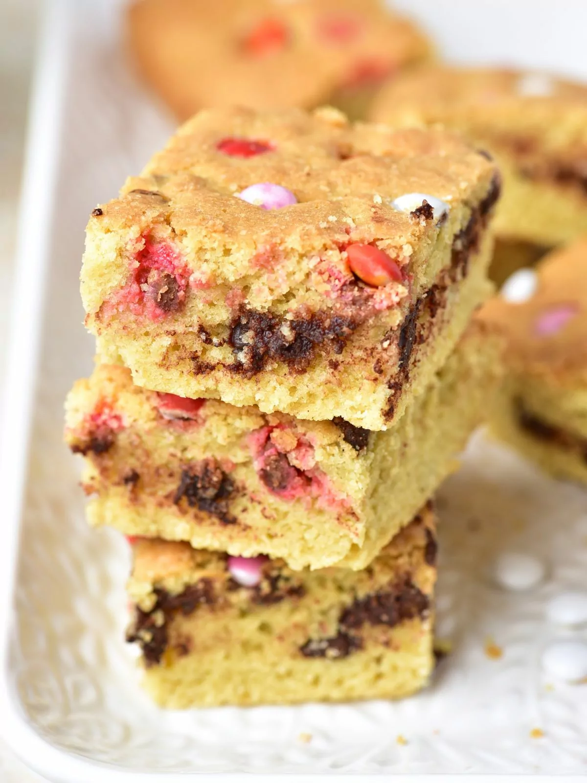 stack of chocolate chip bar cookies with Valentine's Day M&M's