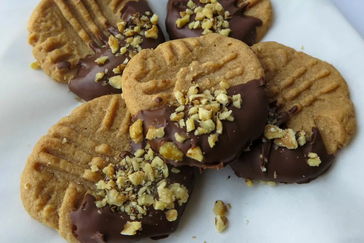 Gluten Free Peanut Butter Cookies dipped in chocolate and chopped peanuts