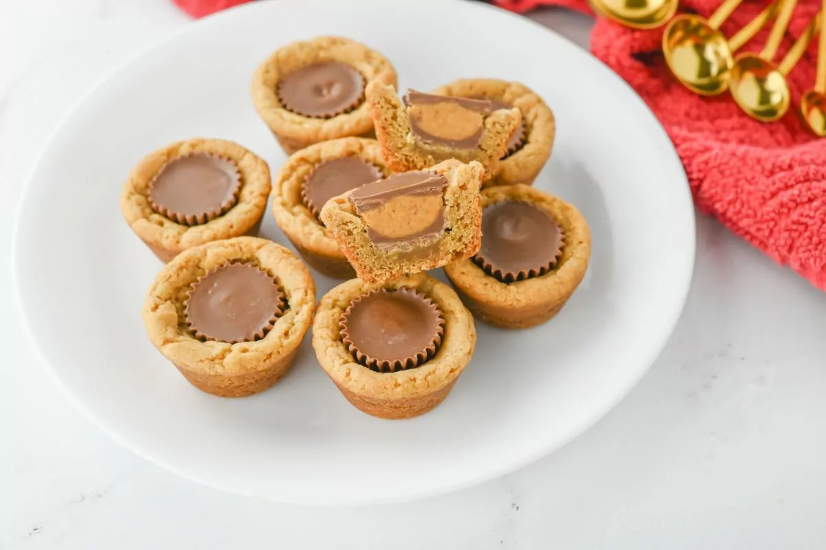 Peanut Butter Cookie Cups with one cut open to show the center