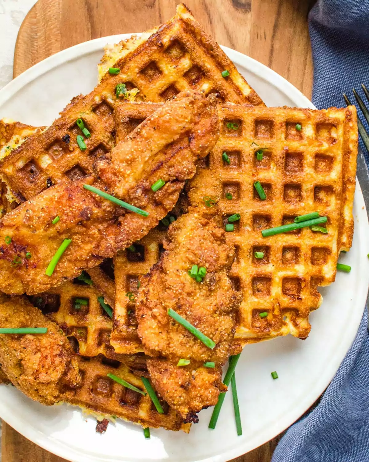 a plate of waffle and chicken