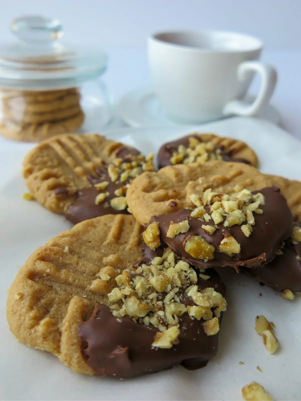 Gluten Free Peanut Butter Cookies dipped in chocolate and chopped peanuts