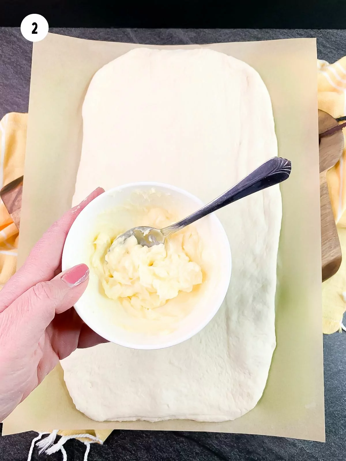 softened butter in a bowl with a spoon