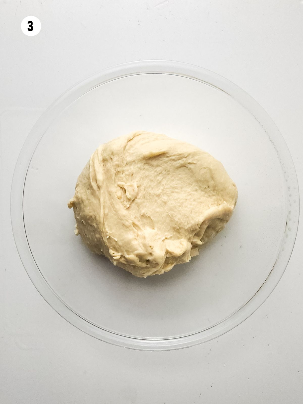 dough in a glass bowl