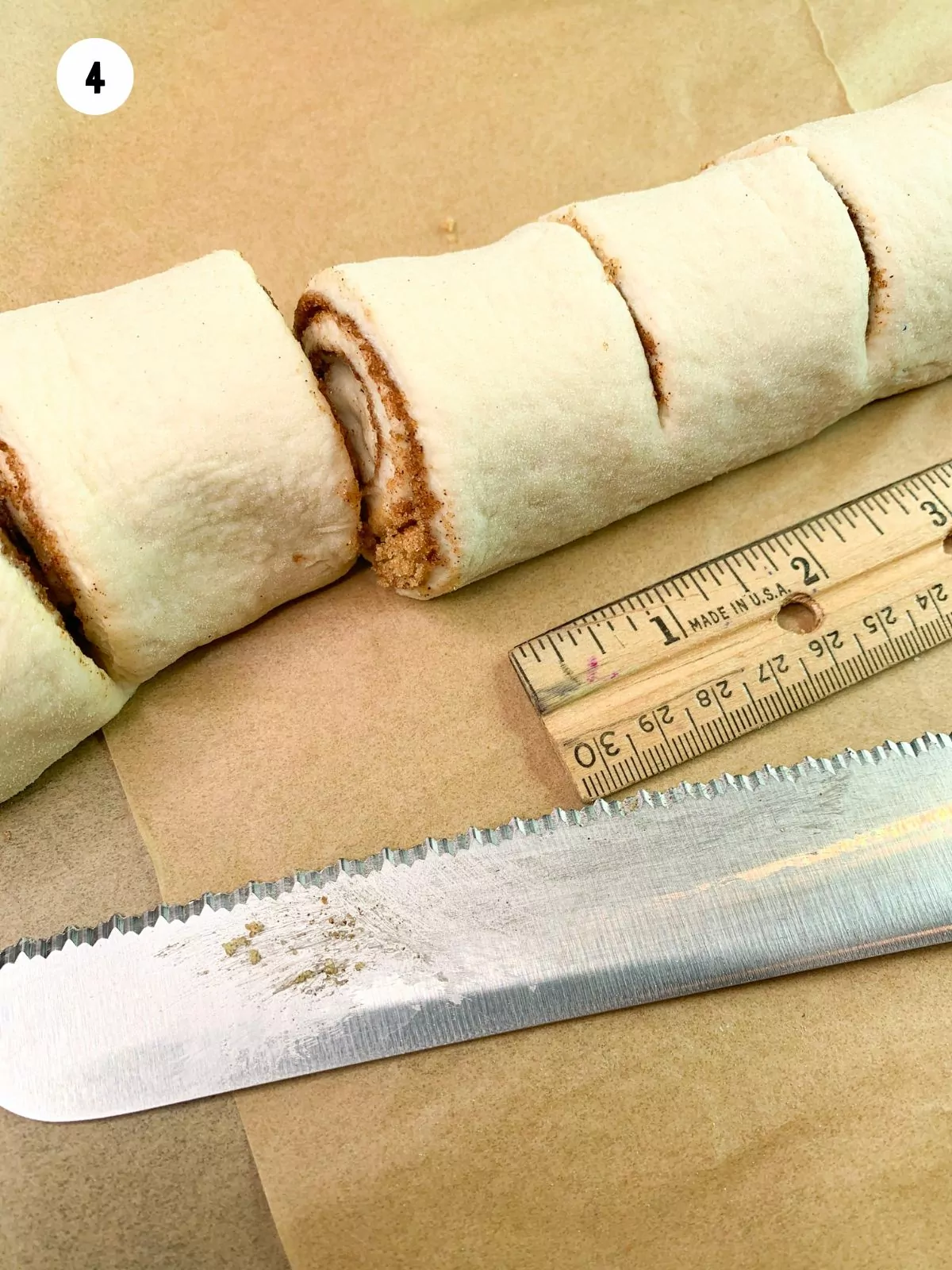 cinnamon rolls cut out using a ruler and serrated knife