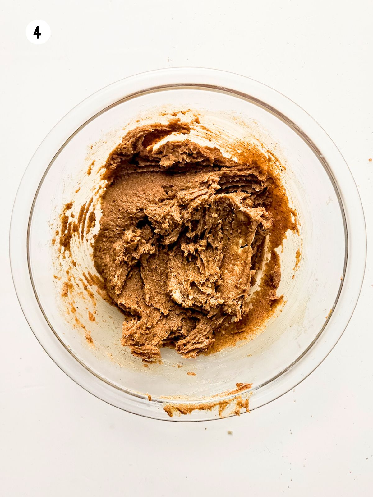 cinnamon sugar mixture in a glass mixing bowl