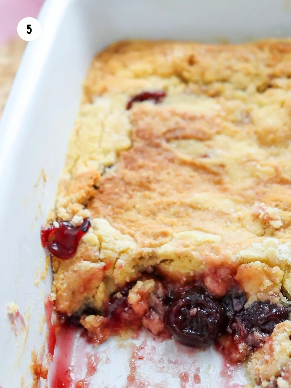 baked cherry dump cake in casserole dish.