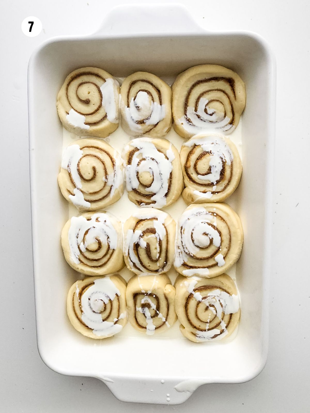 heavy cream poured on top of unbaked cinnamon rolls