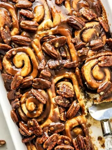 Butter Pecan Cinnamon Rolls in a white baking dish