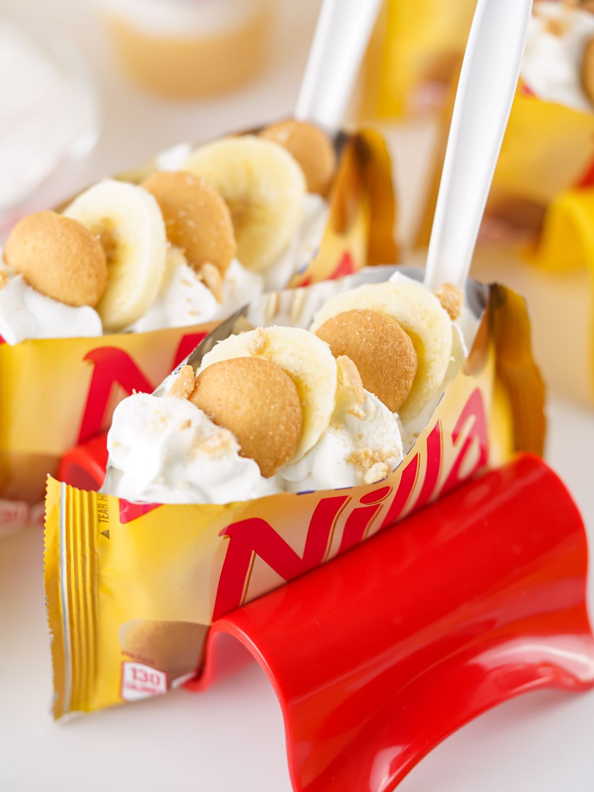 Walking Banana Puddings with white plastic forks in them