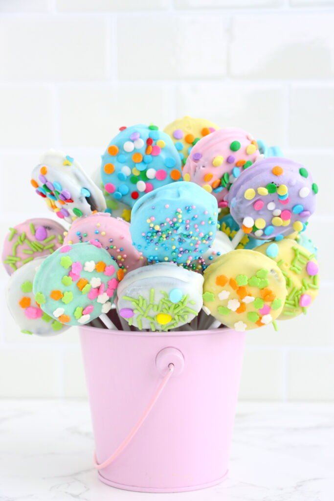 pastel color oreo pops in a bucket can