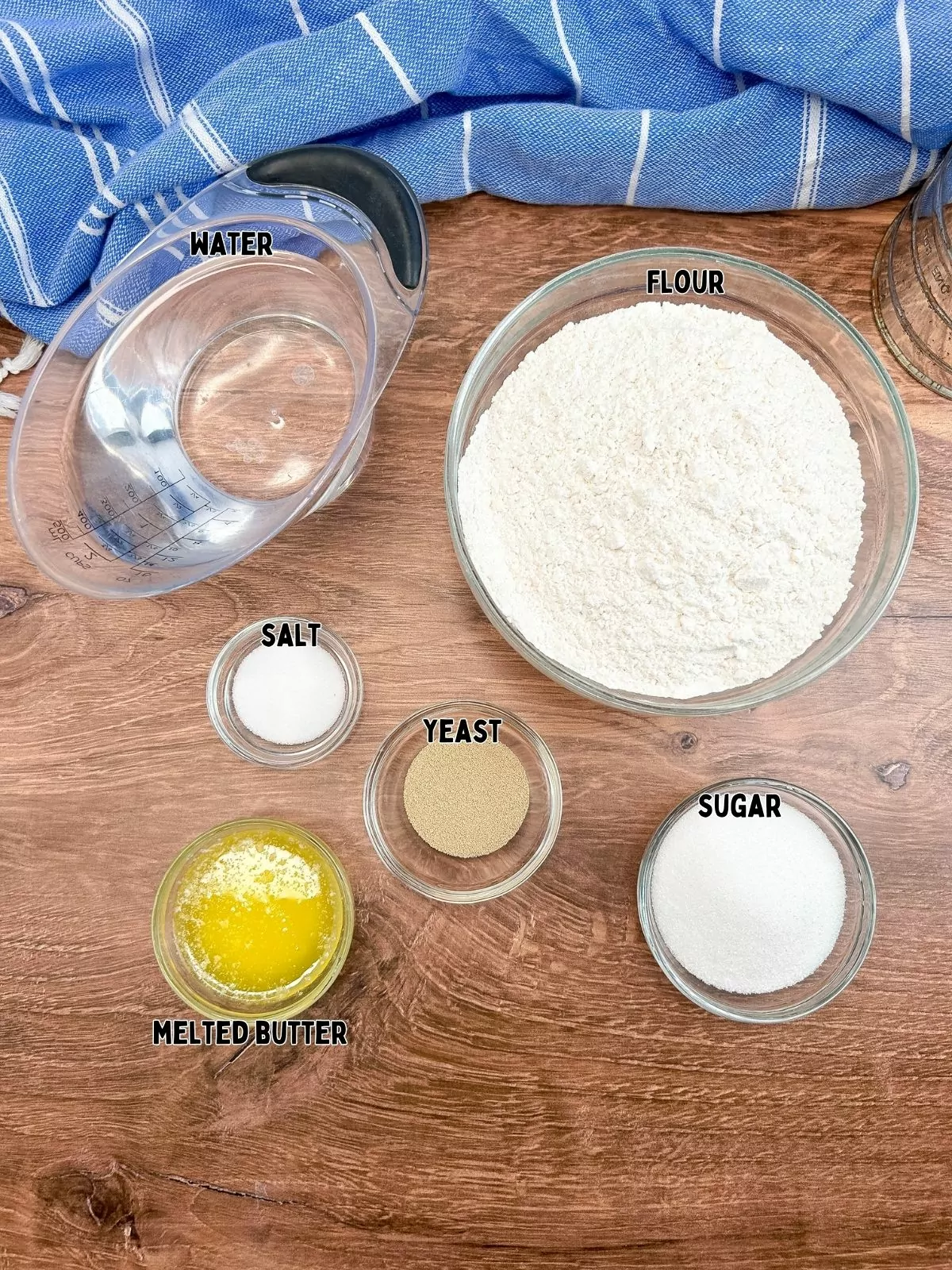 ingredients in small bowls for homemade bread.