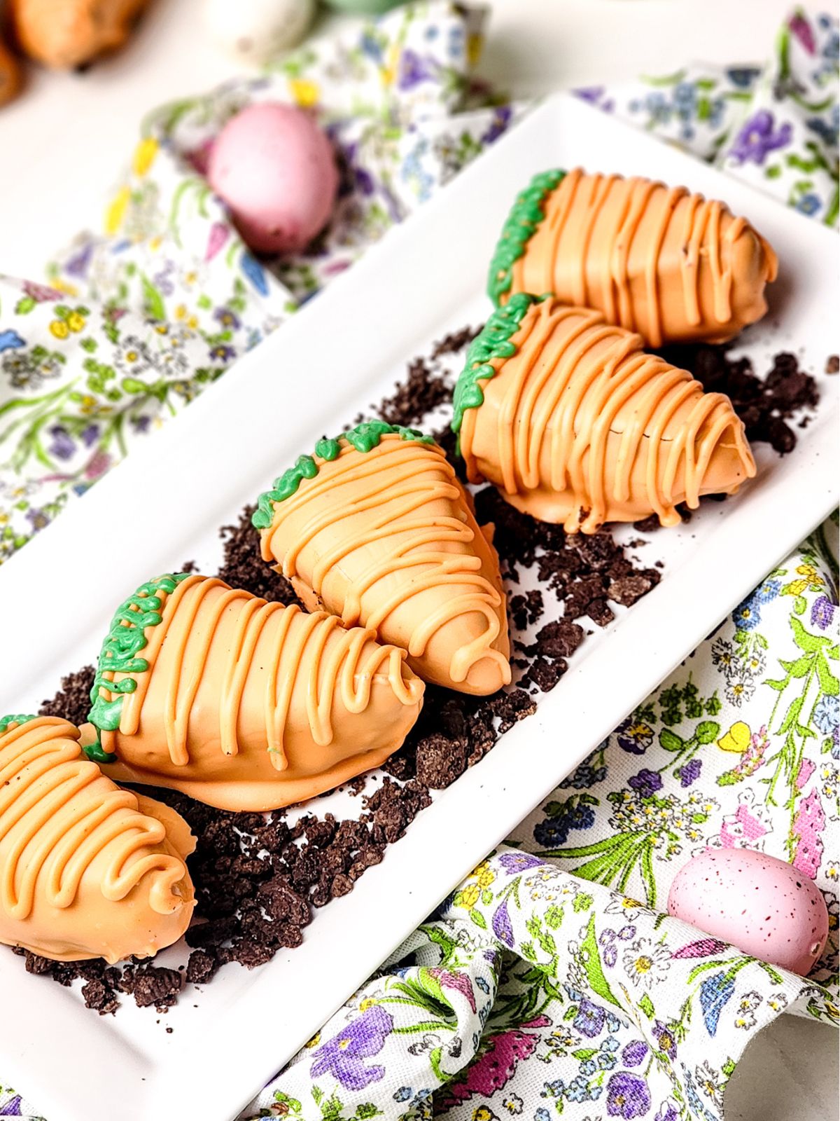 Carrot shaped brownies on a white platter