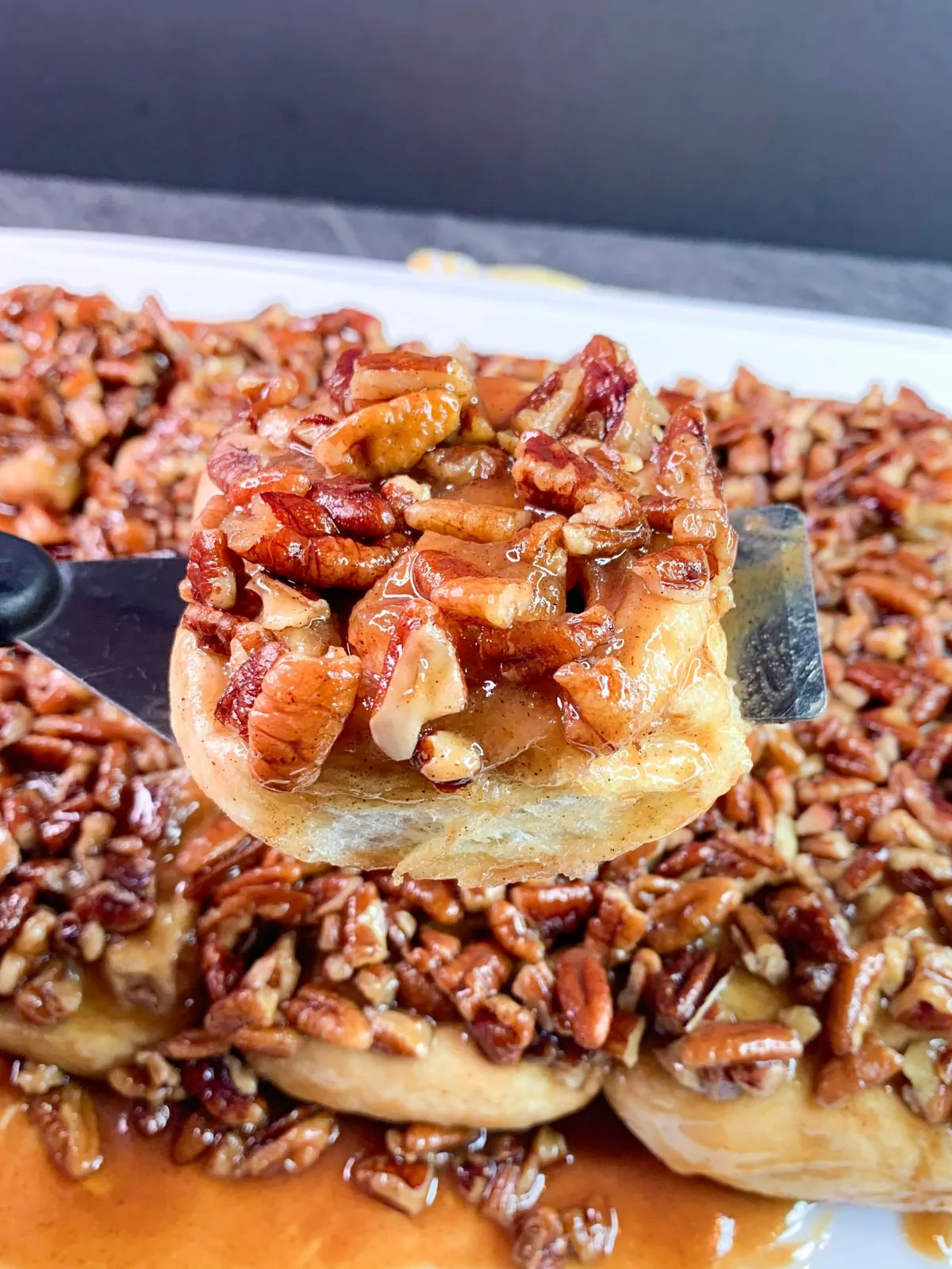 pecan sticky bun on a spatula