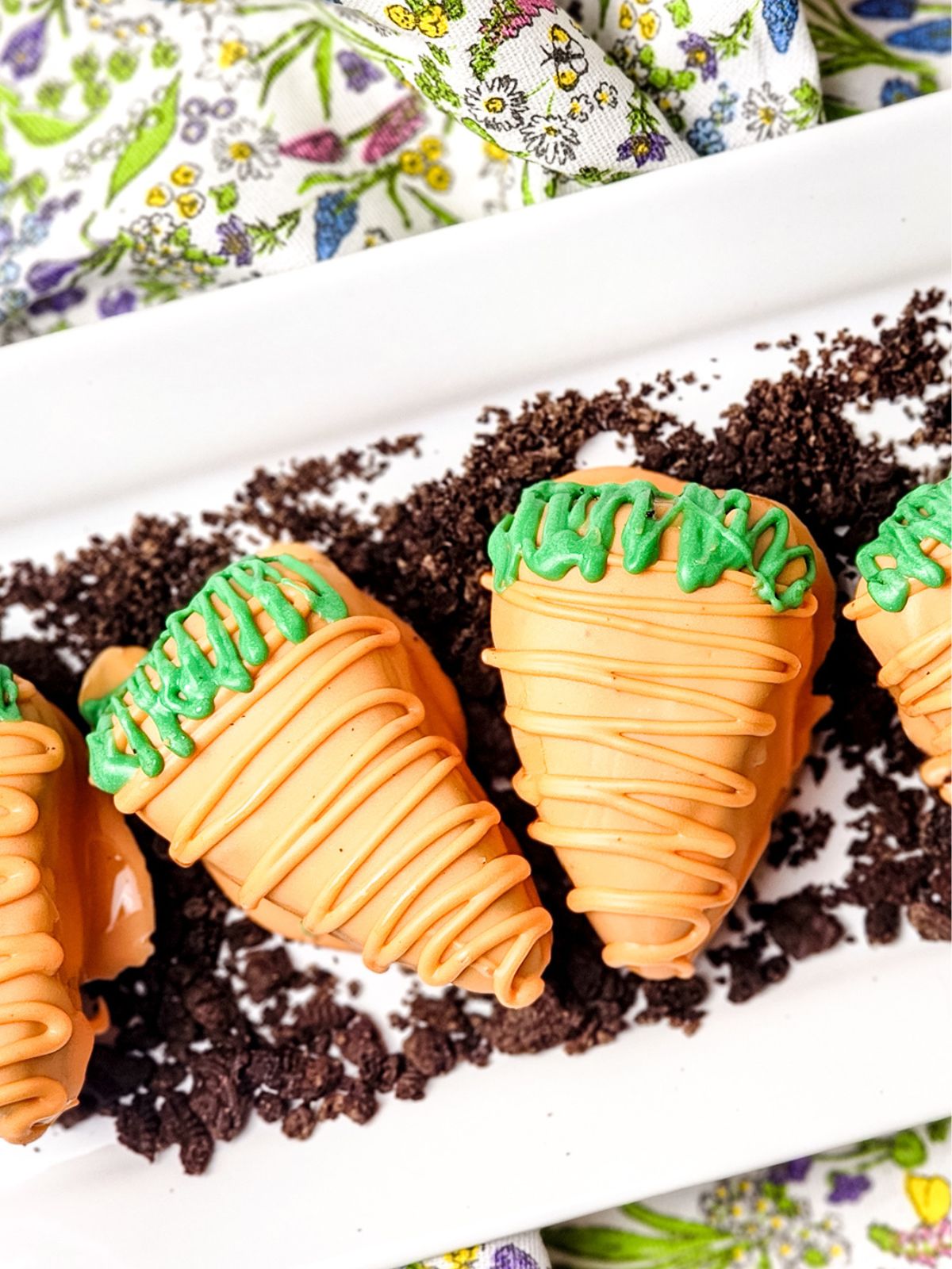 Carrot shaped brownies dipped in orange white chocolate