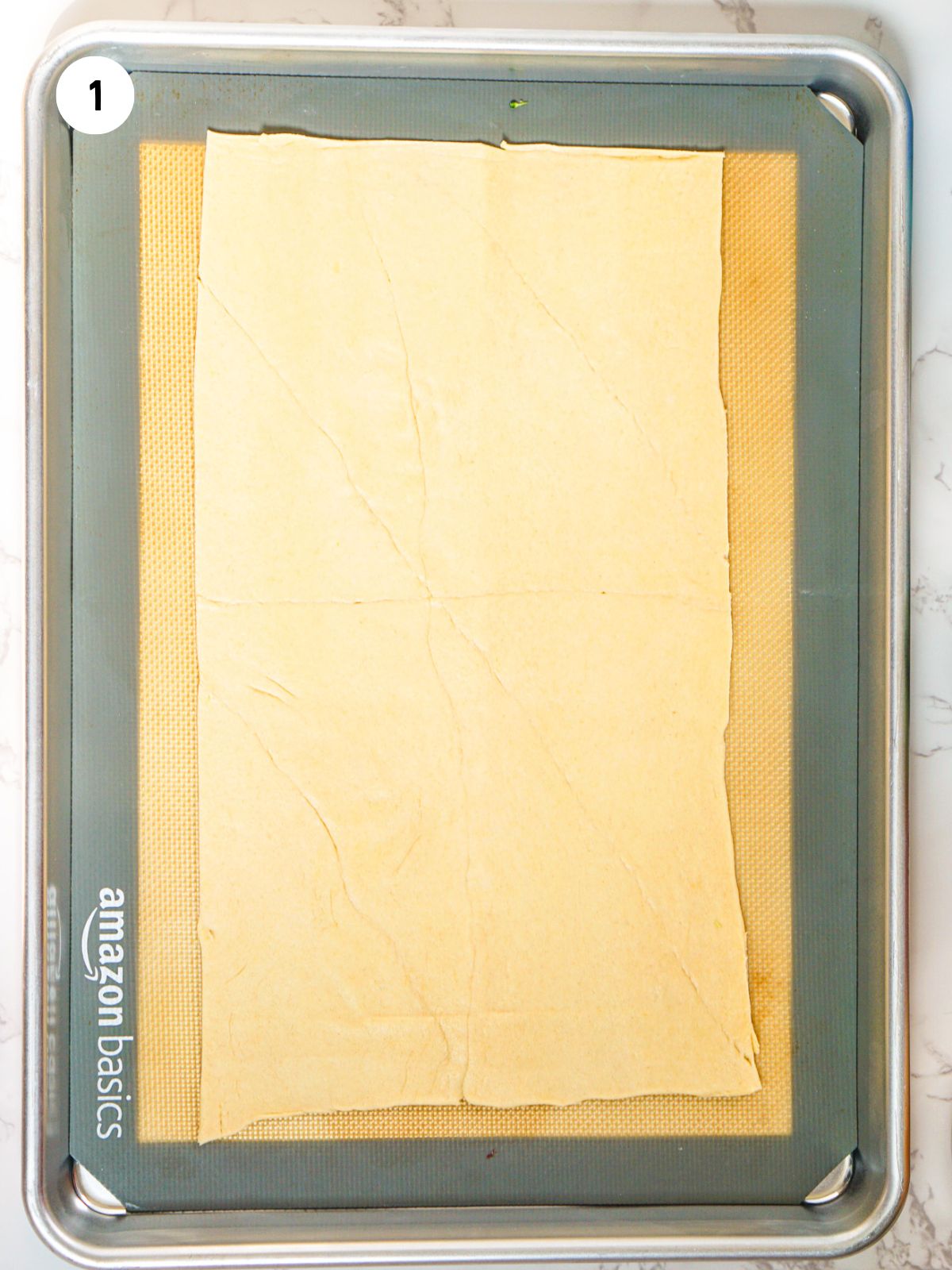 rolled out dough on baking sheet