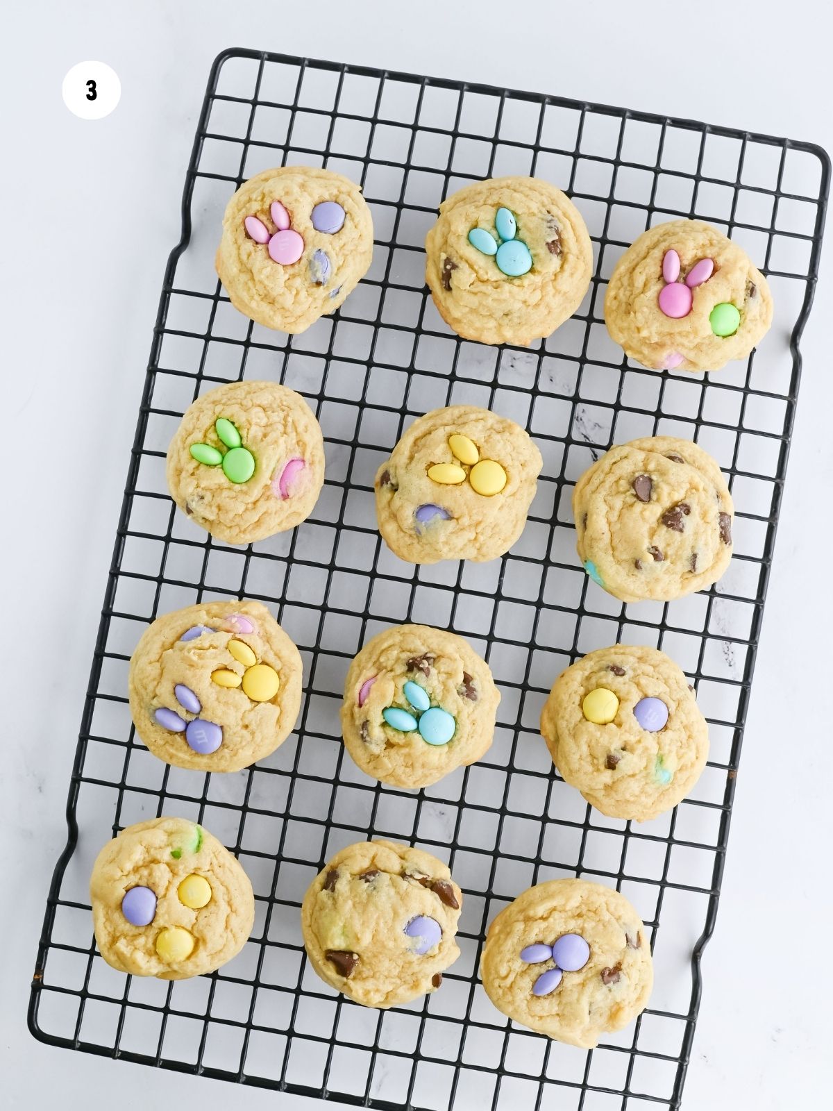 baked chocolate chip M&M cookies on a cooling rack