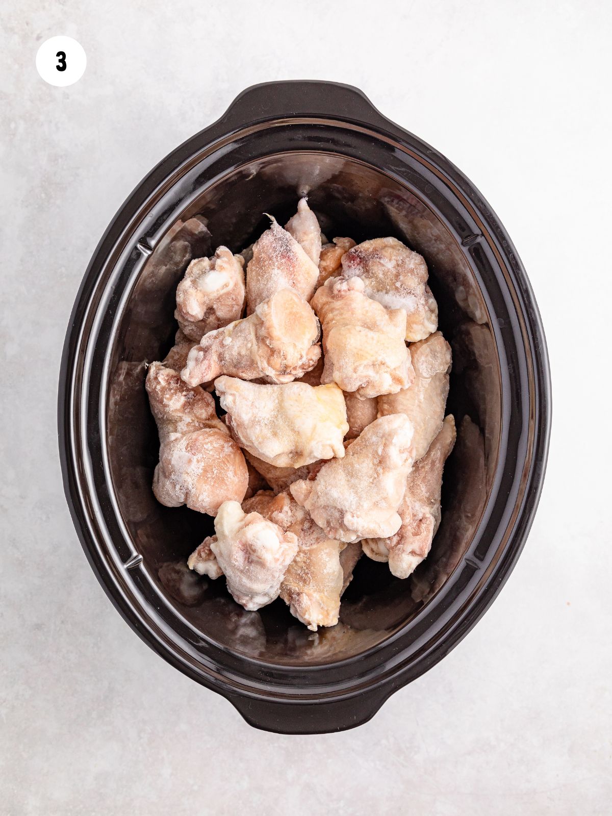 raw chicken wings in a crock pot