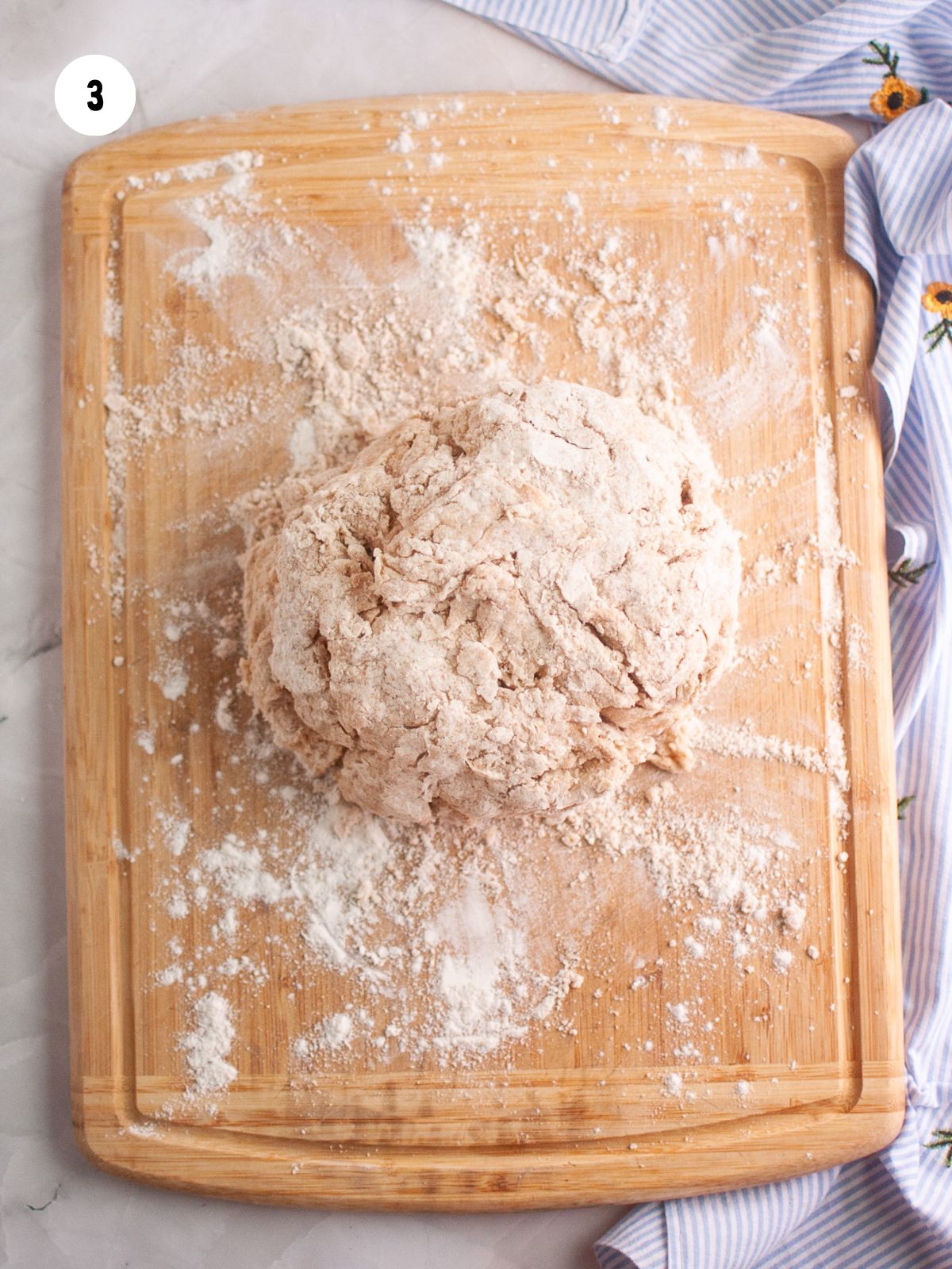 dough on a floured wooden cutting board