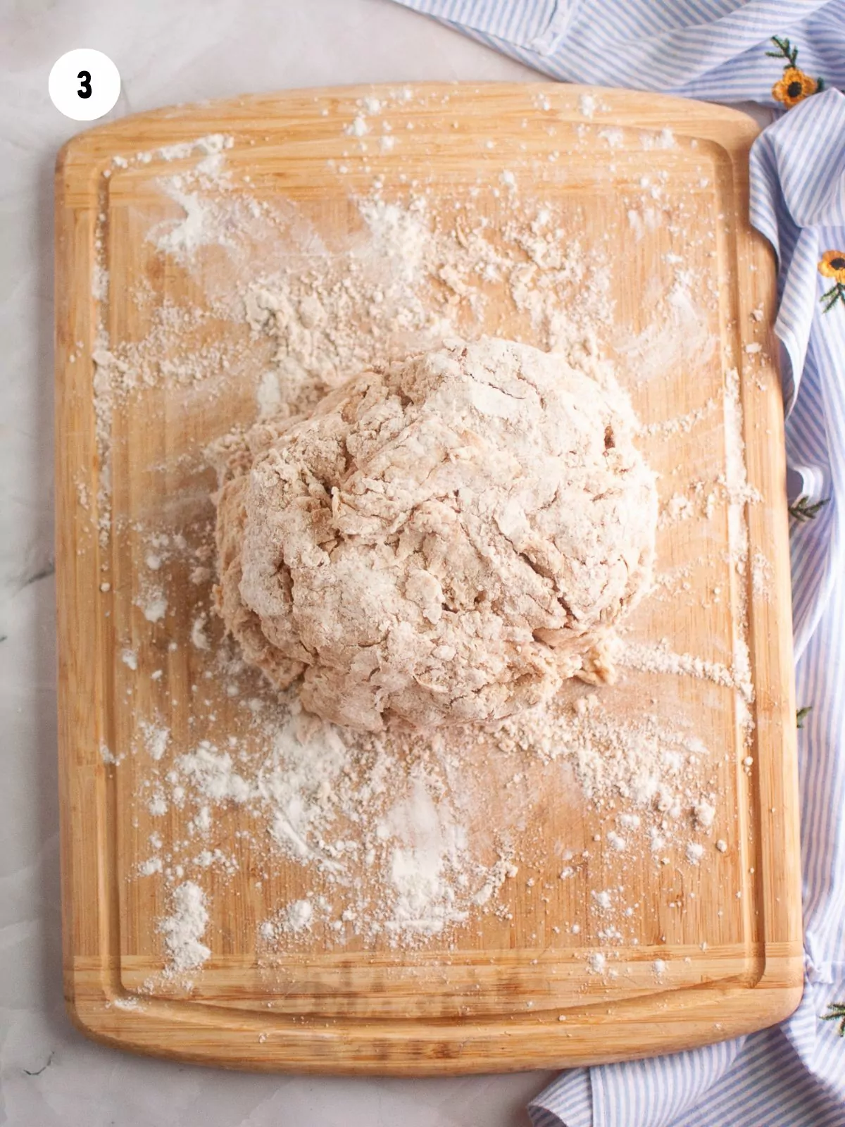 dough on a floured wooden cutting board