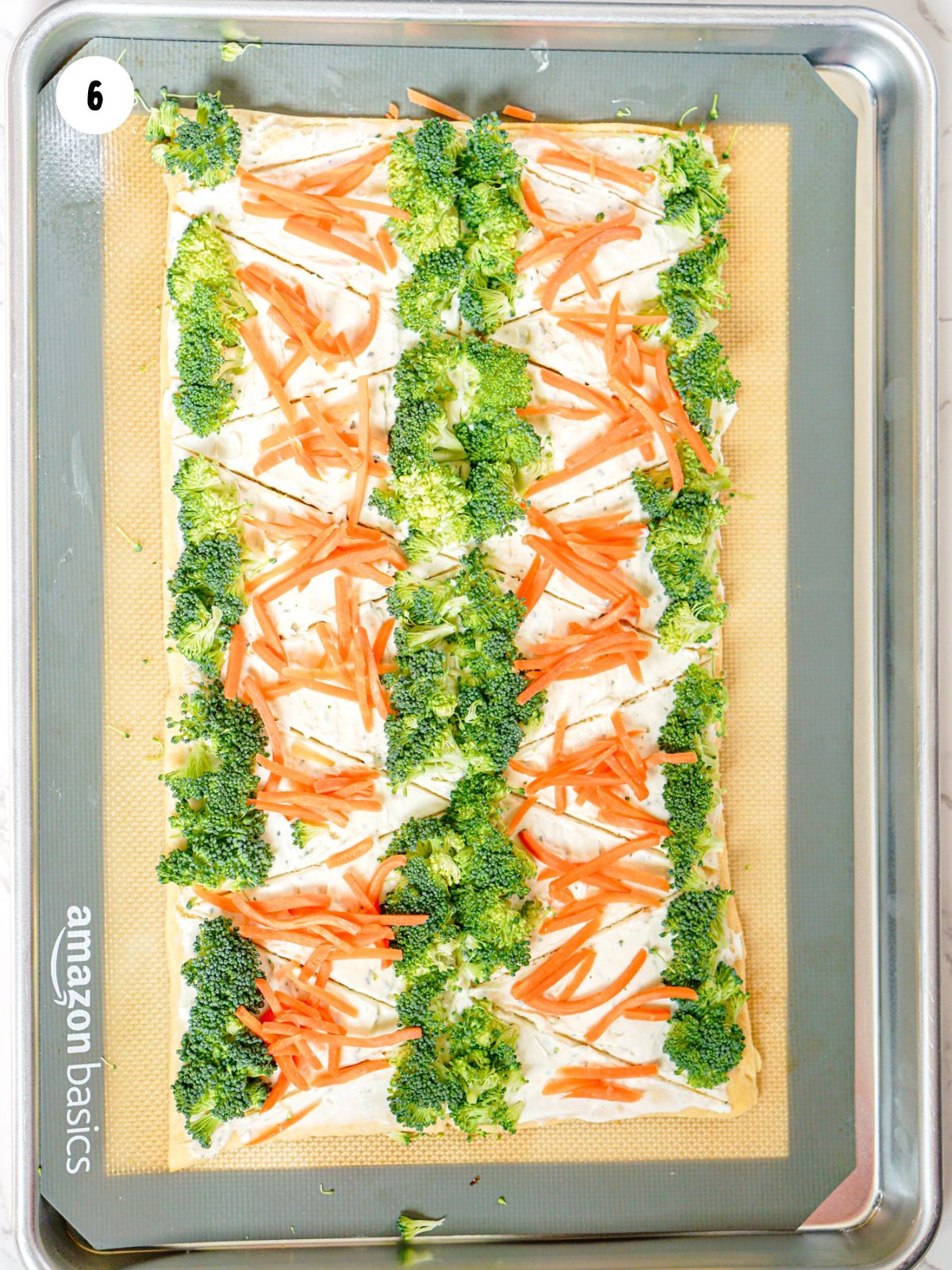 shredded carrots added to the triangles
