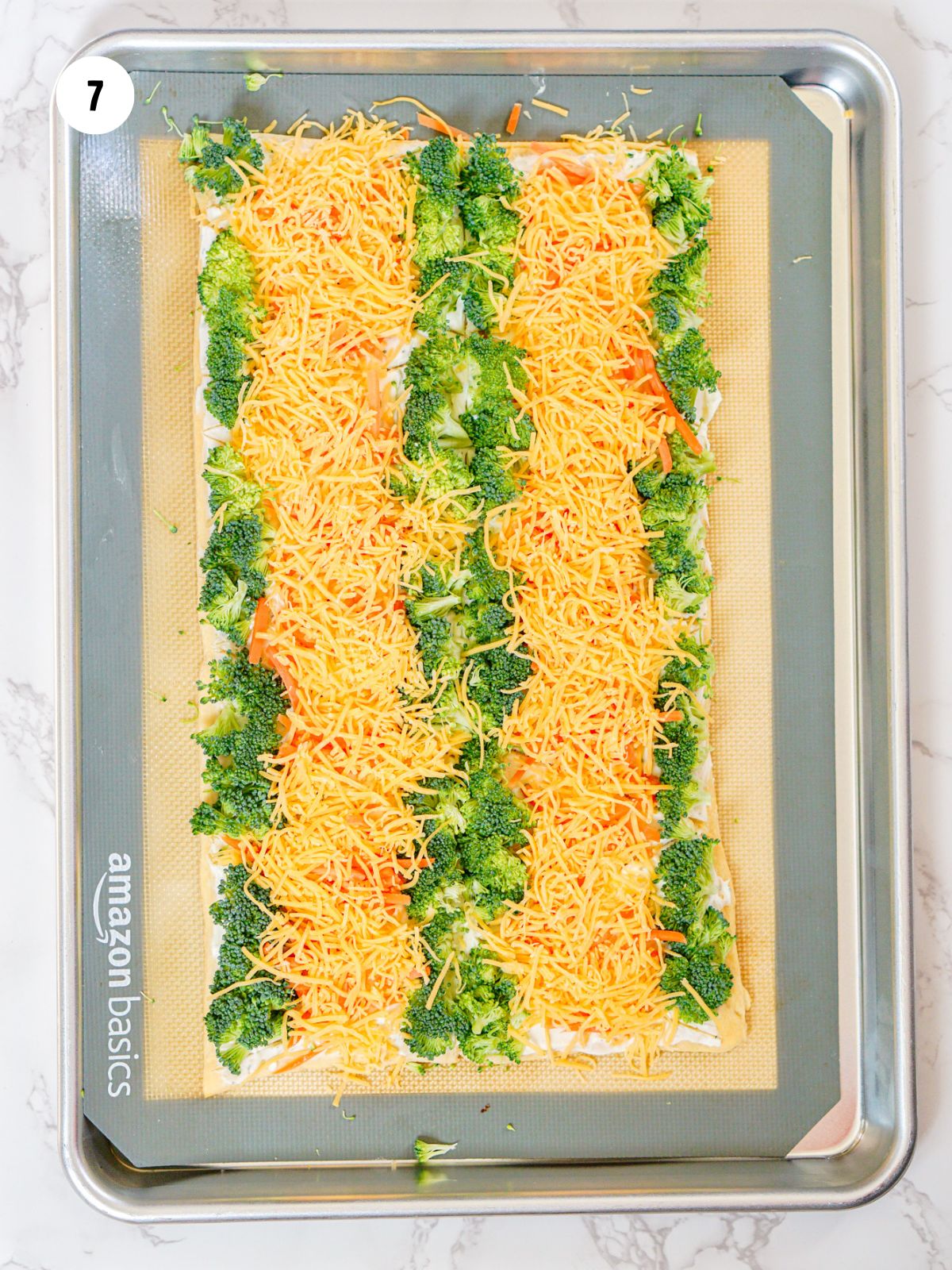 shredded cheddar cheese added on top of the carrots