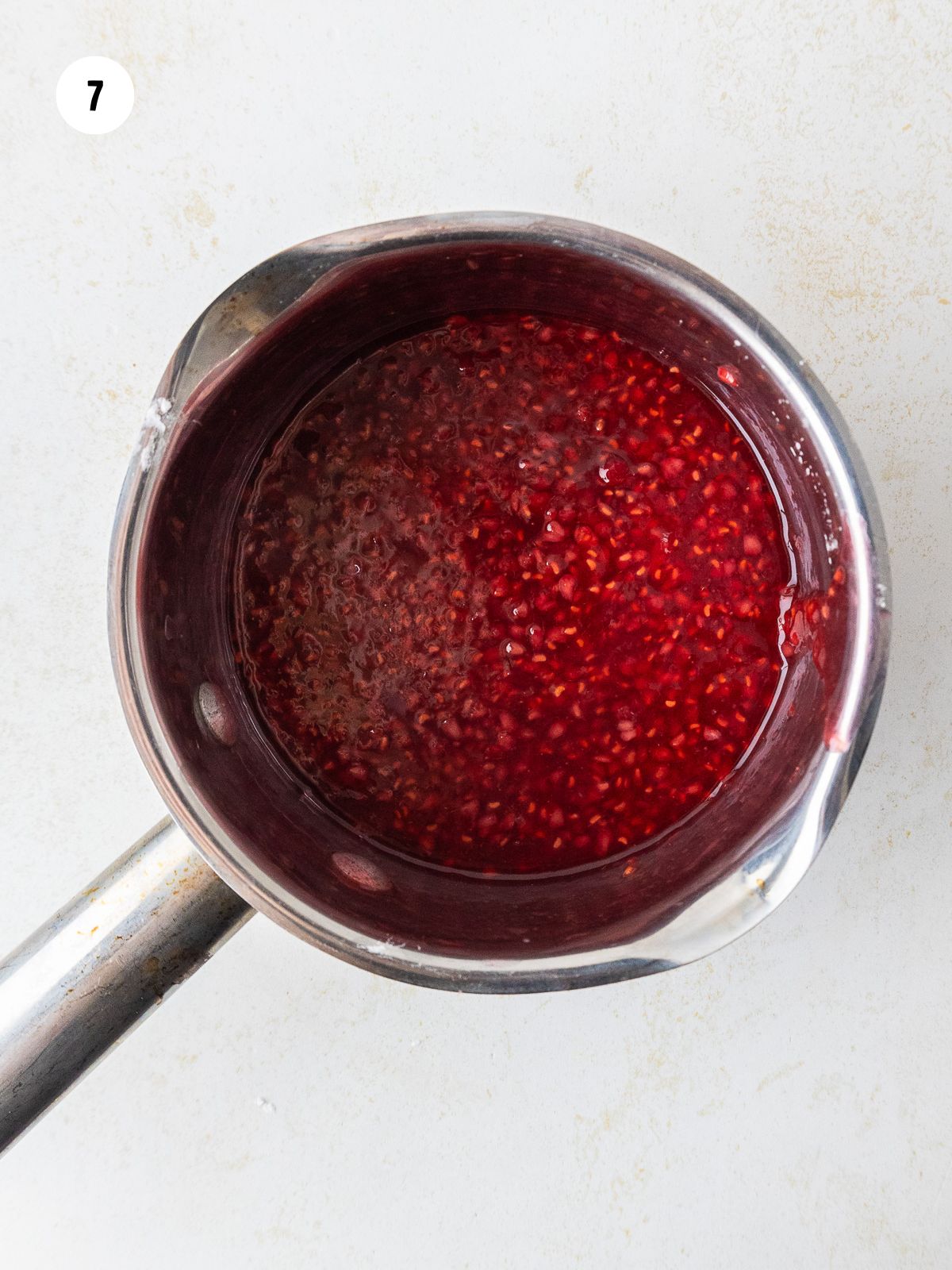 raspberry topping in a saucepan
