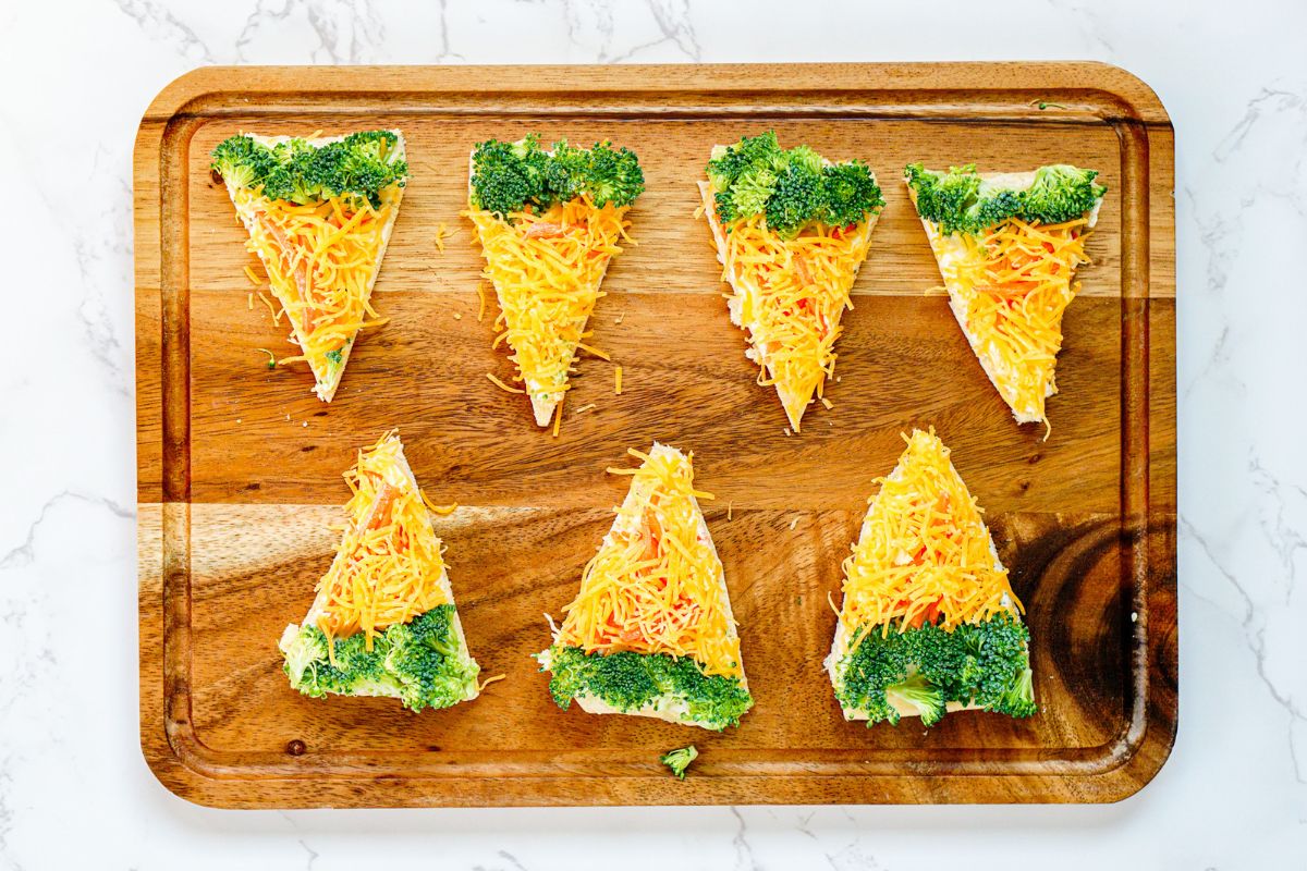 Easter Carrots Veggie Pizza served on a wood board